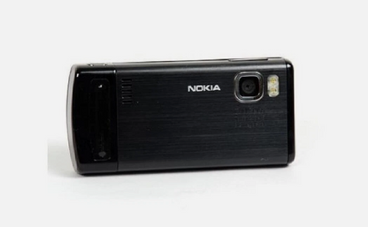 A black Nokia flip phone with a brushed metal back cover, shown from the rear on a plain white background.