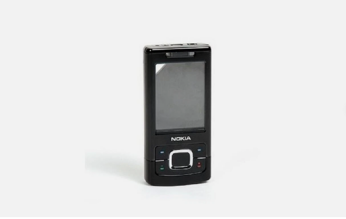 A black Nokia mobile phone with a physical screen and physical navigation buttons, standing upright on a light gray background.
